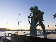 The Helmsman statue is located at the far end of Burton Chace Park in Marina del Rey.