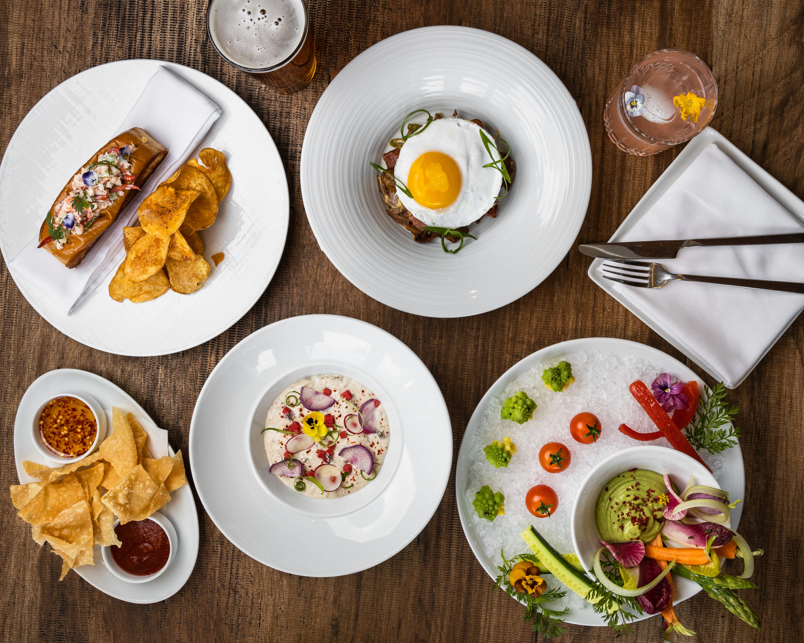A variety of plated food at Marina del Rey Hotel's SALT Restaurant