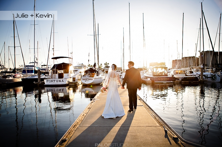 Newly married couple walking at the backwater pier