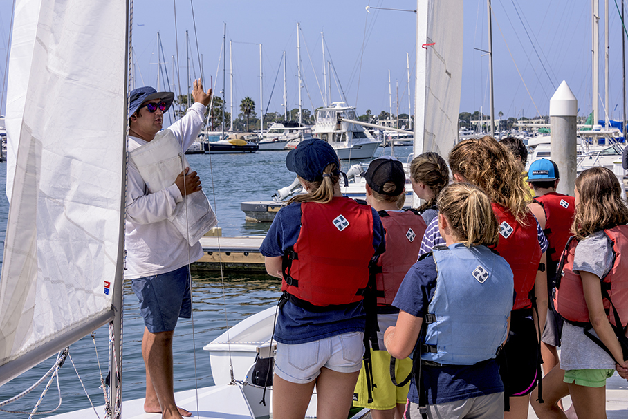 sailer explaining young children in sailing camp