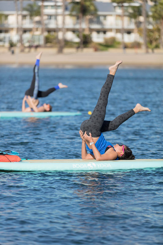 group yoga class on paddle board 