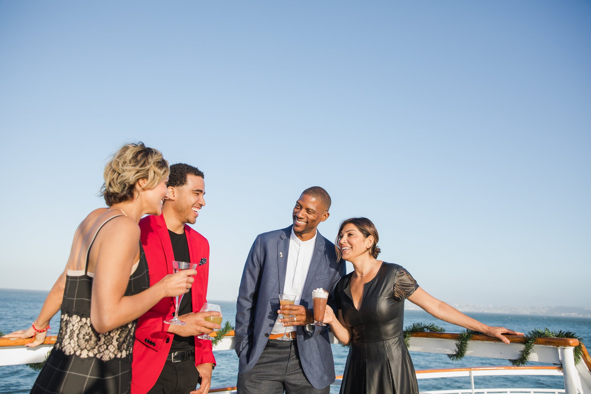 Two couples aboard a dining cruise, a holiday party venue in Marina del Rey