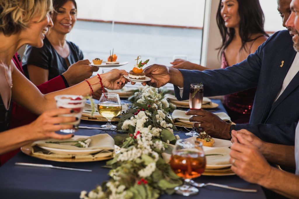 Friends sitting at a table during brunch in a dining cruise ship