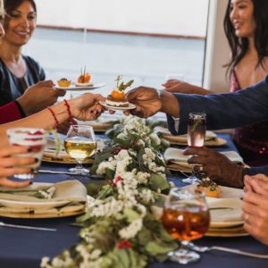 Friends sitting at a table during brunch in a dining cruise ship