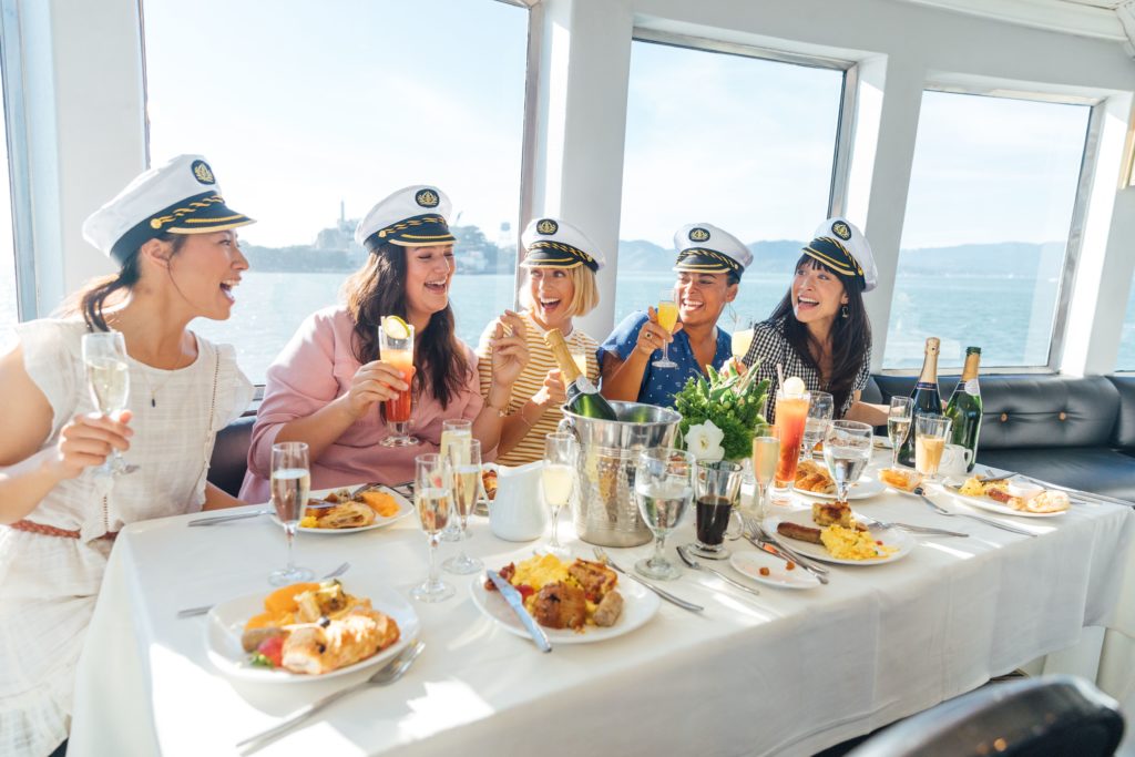 Group of girls having brunch on dining cruise in Marina del Rey