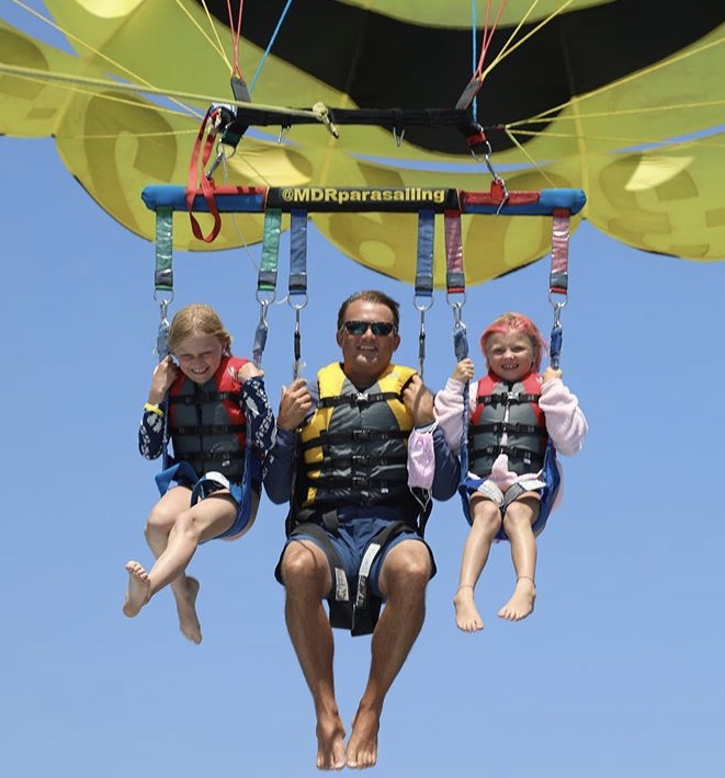 Father and kids parasailing out of Marina del Rey