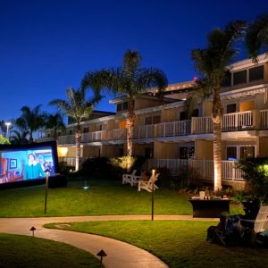 Movie screen outdoors on lawn for outdoor movie night