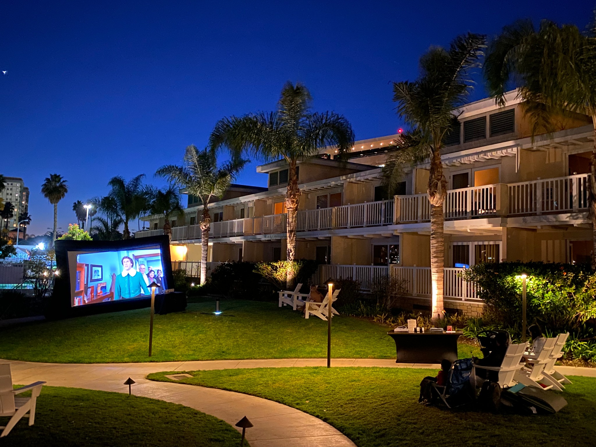 Movie screen outdoors on lawn for outdoor movie night