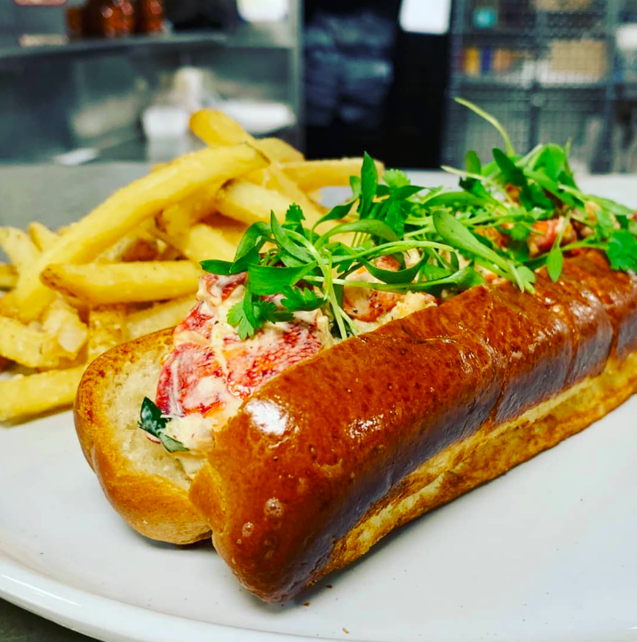 Lobster roll sandwich with fries