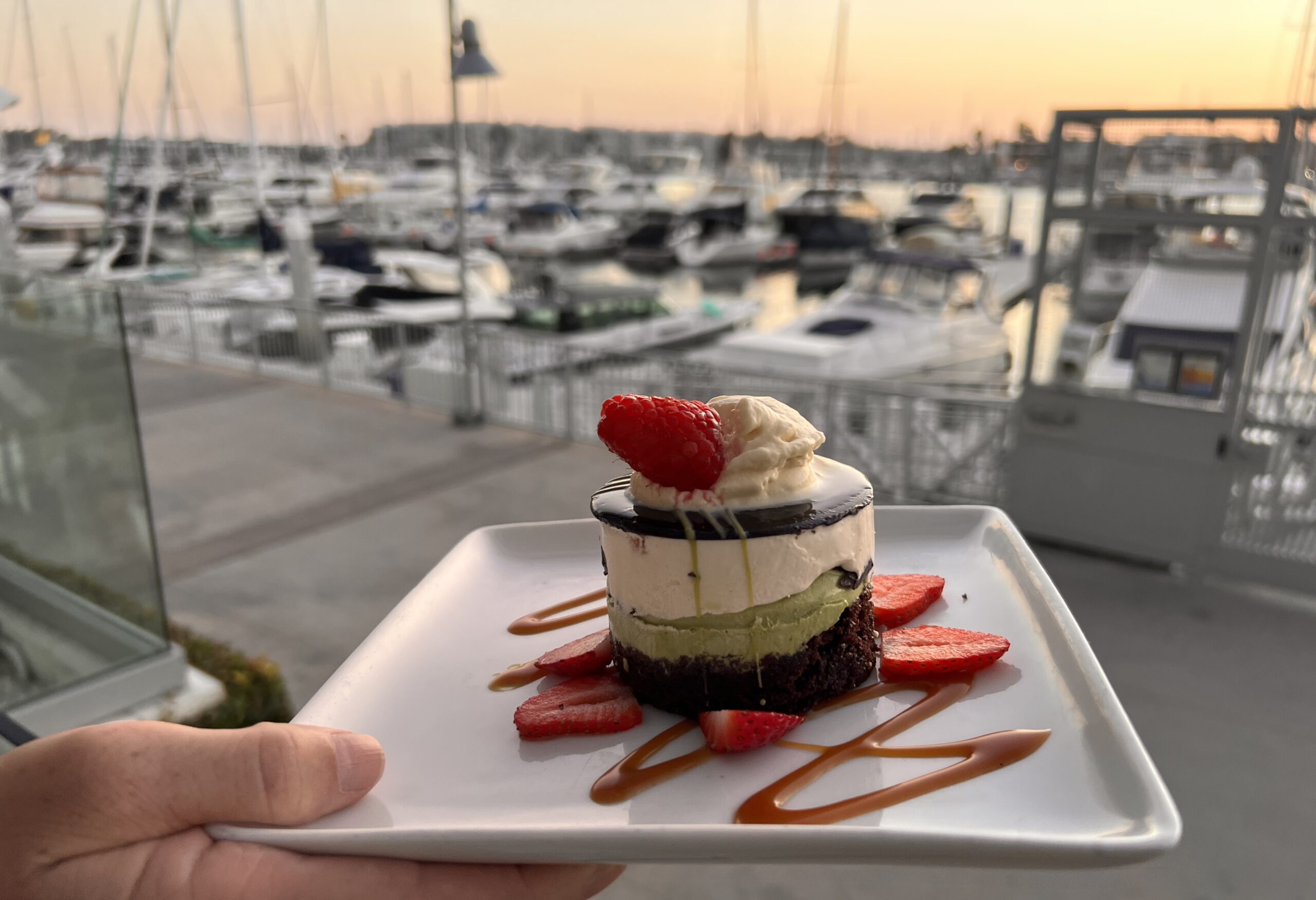 Dessert on a plate overlooking harbor