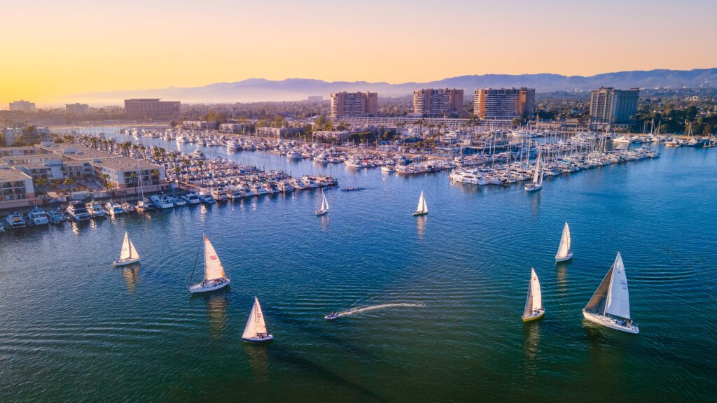Aerial shot of sailboats in the channel during sunset