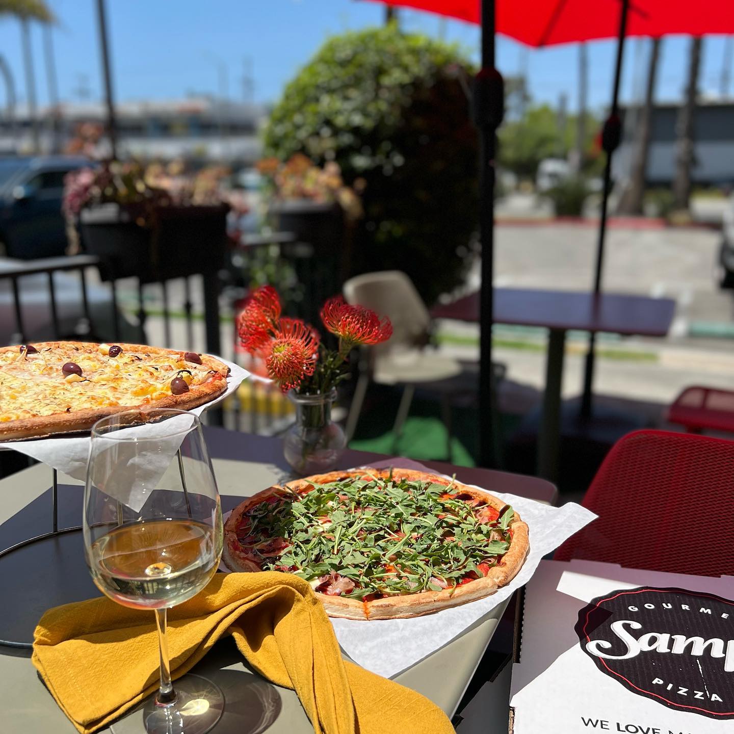 Sampas pizza cafe patio table outside with pizza