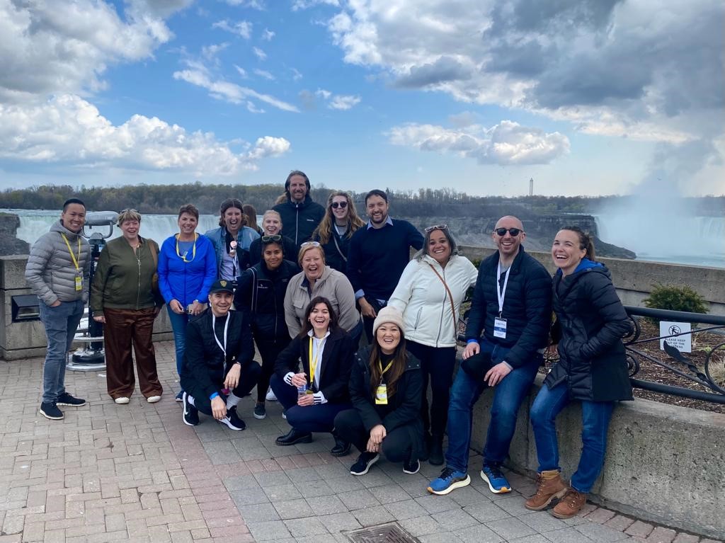 Group of people standing in front of vista overlooking Niagara Falls
